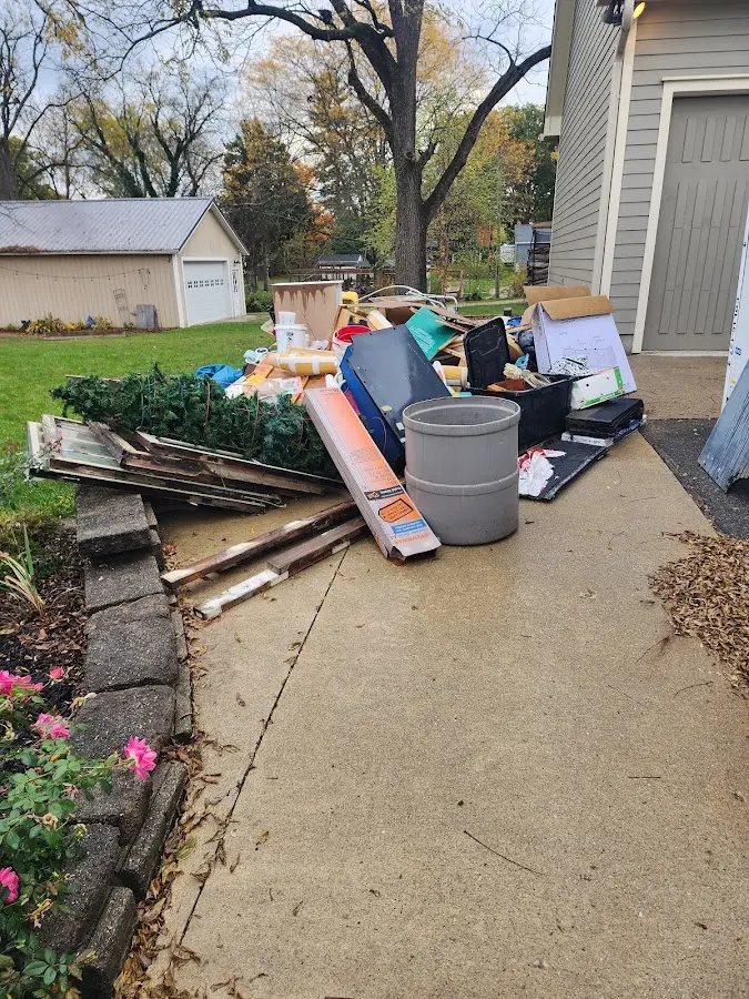 Dumpster being loaded with debris for Demolition Dumpster Rental in Trotwood